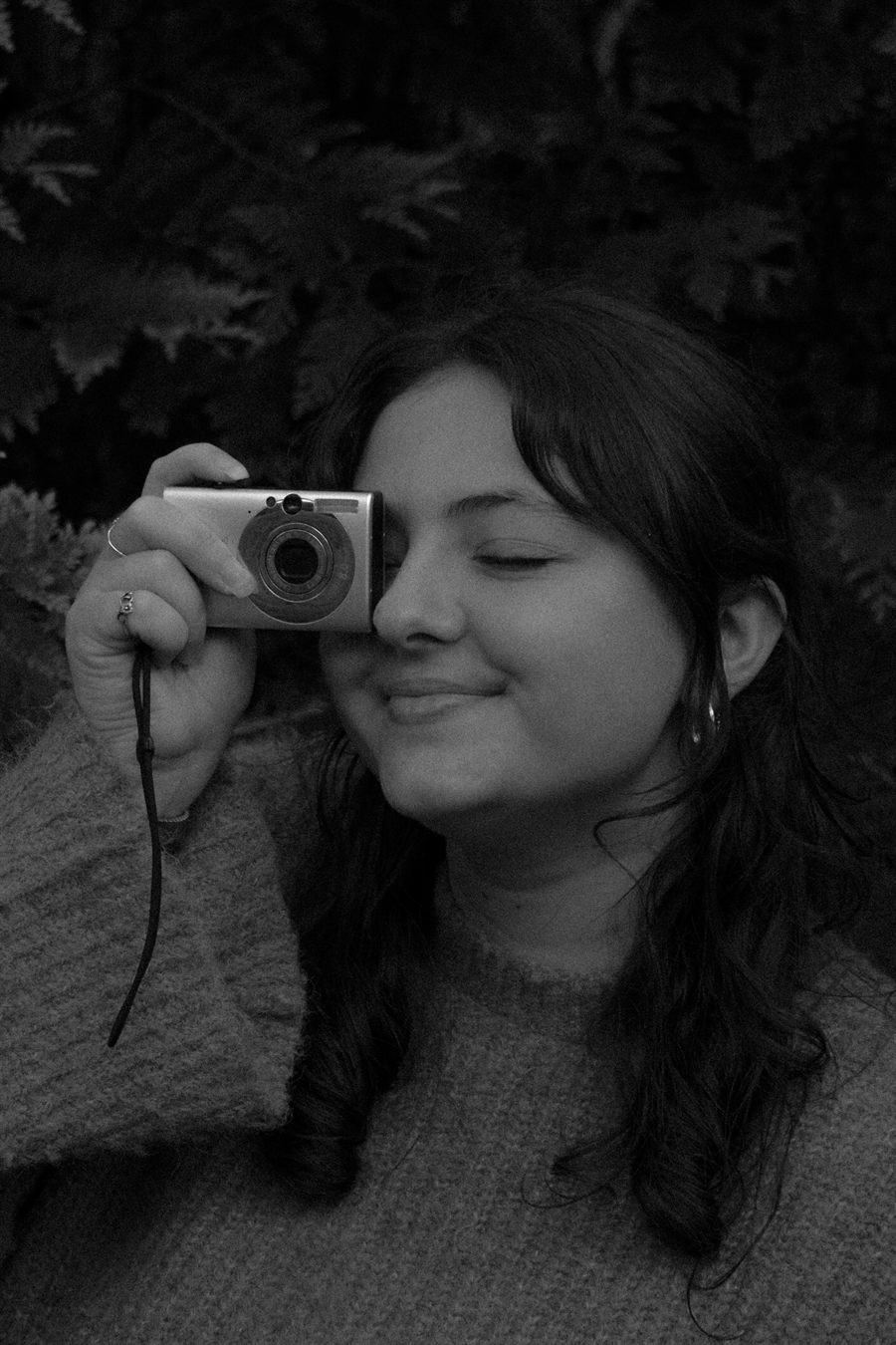 Anisa holding her camera to her eye